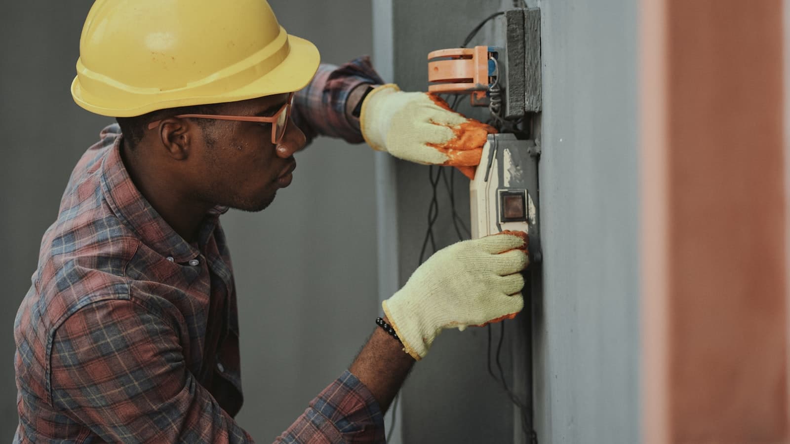 Licensed electrician working on an electrical panel